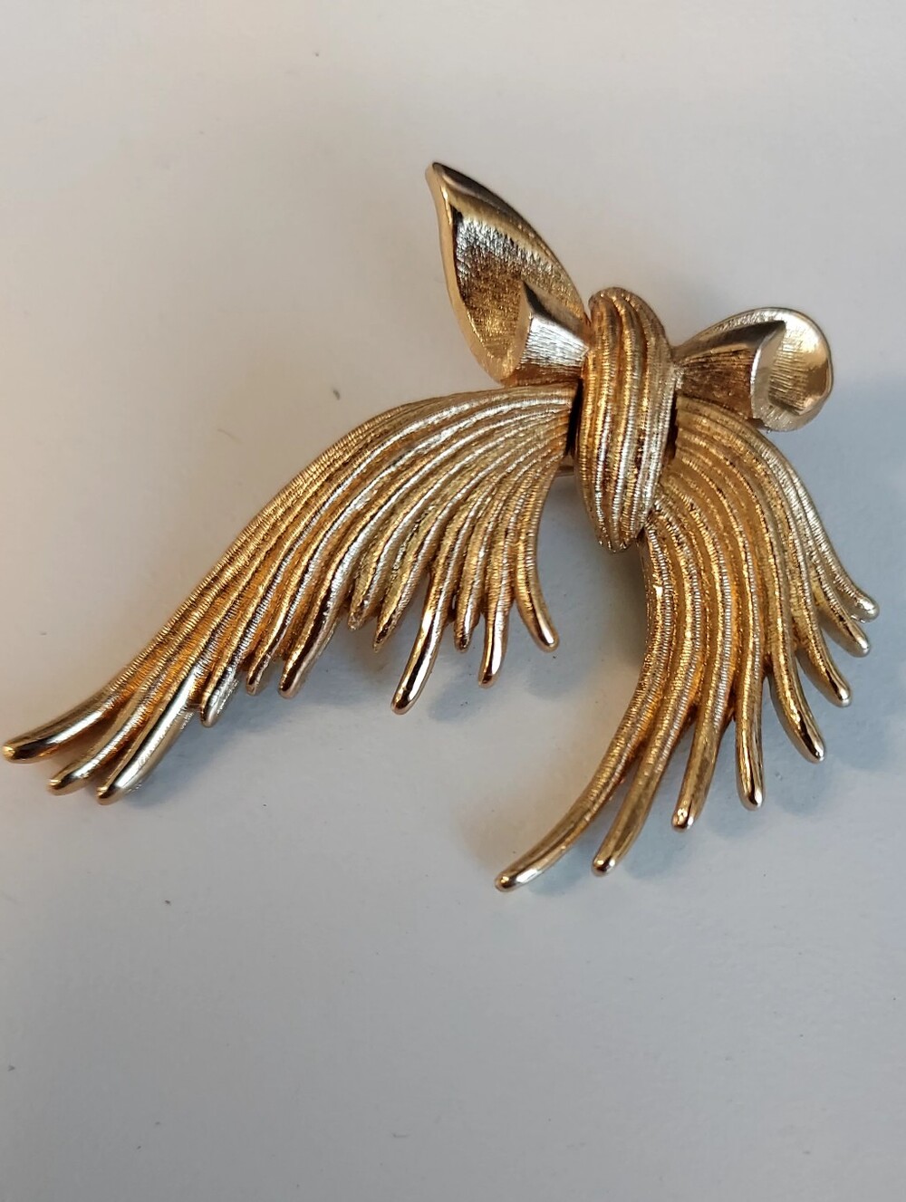 Monet Gold-Tone Ribbon Brooch with Textured Streamers